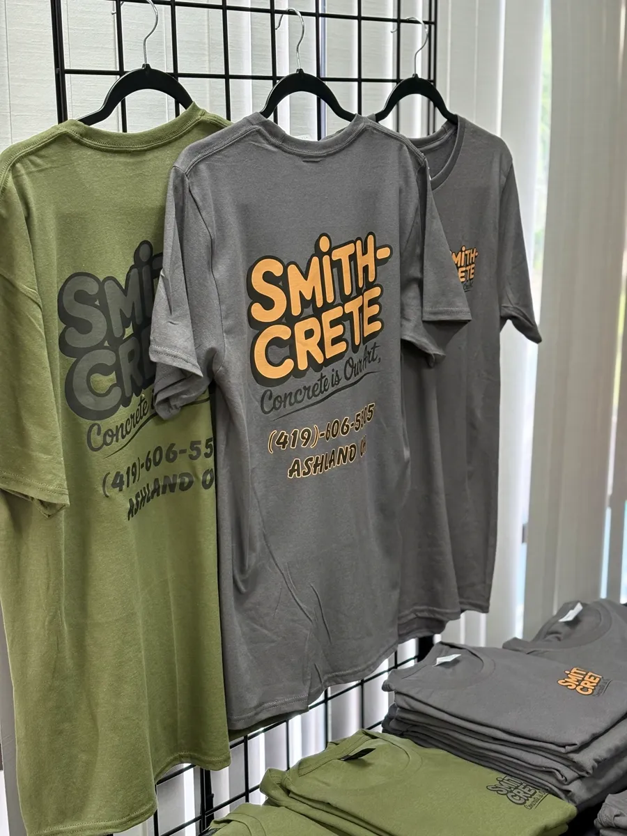 DTF printed event apparel stacked for a branded order