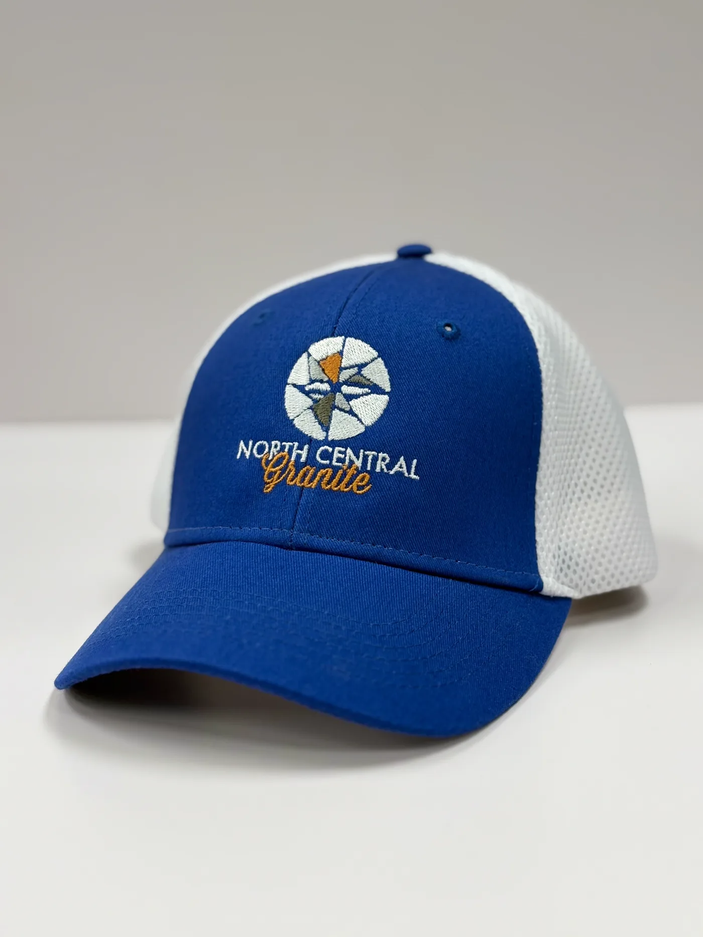 Custom event headwear prepared for a branded apparel run